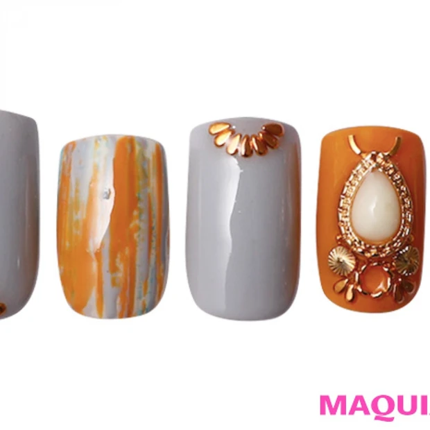 ネイティブアメリカンな輝きを引き立てる、スモーキーな「秋オレンジ」ネイル