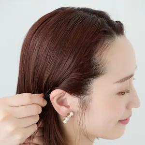 【ミディアム②きちんとスーツ】顔まわりのねじりがアクセントの上品ダウンスタイル　STEP６